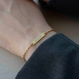 Златиста Гривна Спомен с 18К позлата – Персонализирана с Гравиране на ръката, с името МАРИЯ.