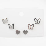 Modern butterfly and heart earrings set in gold and silver, designed for multiple piercings, made of medical stainless steel.