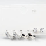 Комплект обици сребристо, включващ две двойки обеци и кристални декорации.