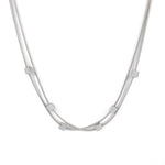 Двойно колие с плетка и кубчета в сребрист цвят, изработено от медицинска стомана.