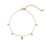 Гривна за глезен с блестящи циркониеви камъни и златисто покритие.