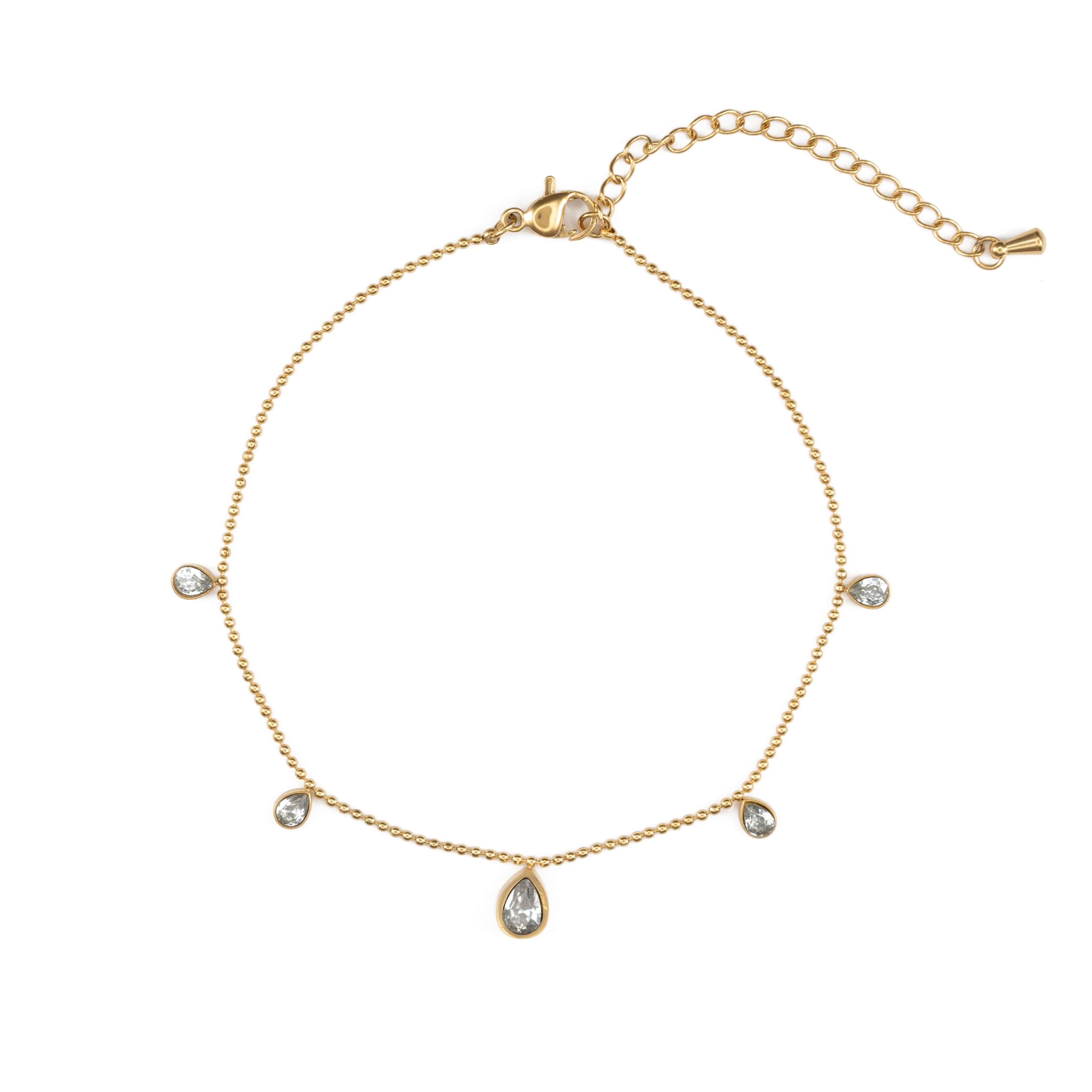 Гривна за глезен с блестящи циркониеви камъни и златисто покритие.