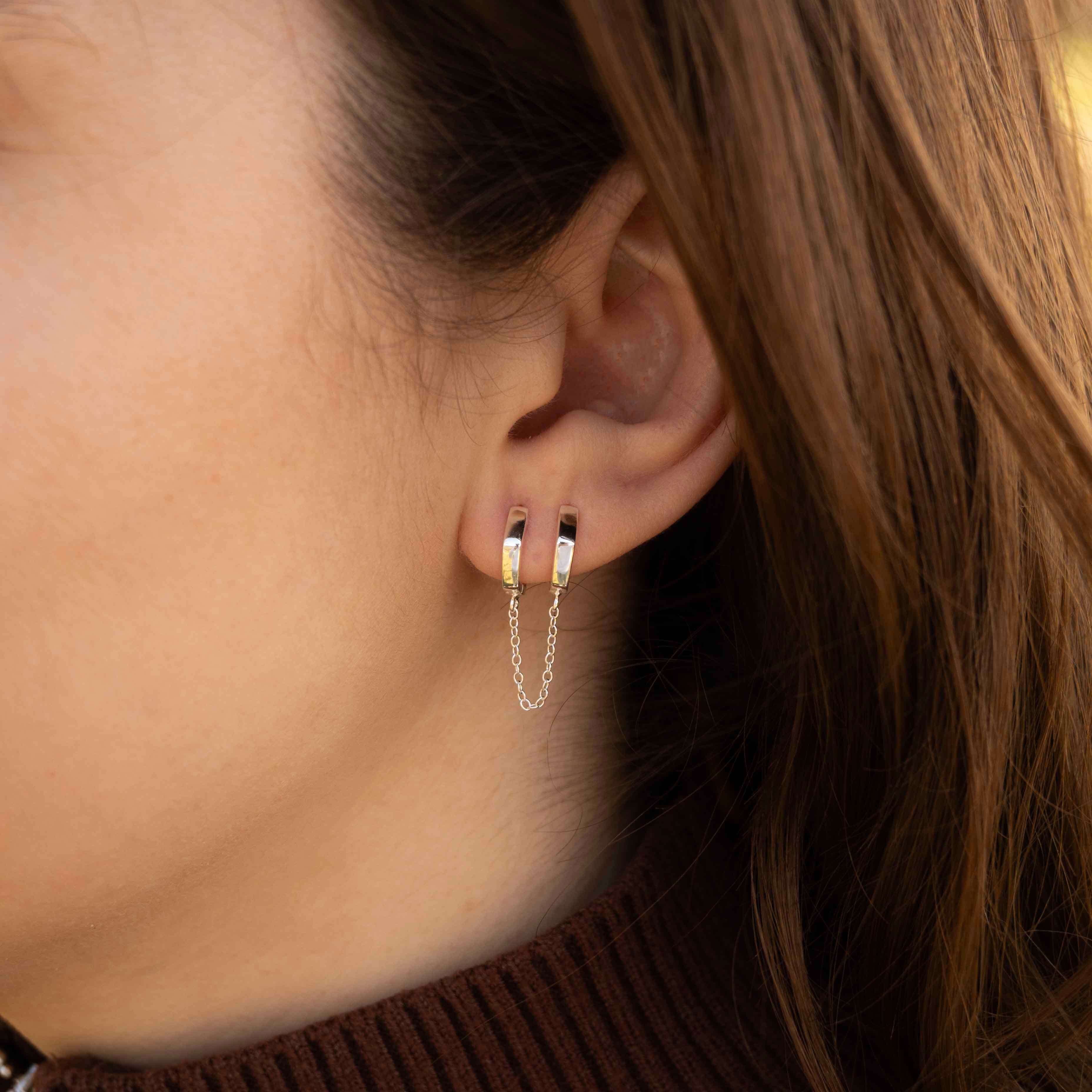 Сребърни Обеци Double Flow S925 - обеци пиърсинг с елегантен дизайн, подходящи за хрущял.