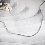 Елегантно сребристо колие с топчета