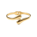 Гривна с 18К златно покритие - елегантен аксесоар от медицинска стомана за свързаност и баланс.