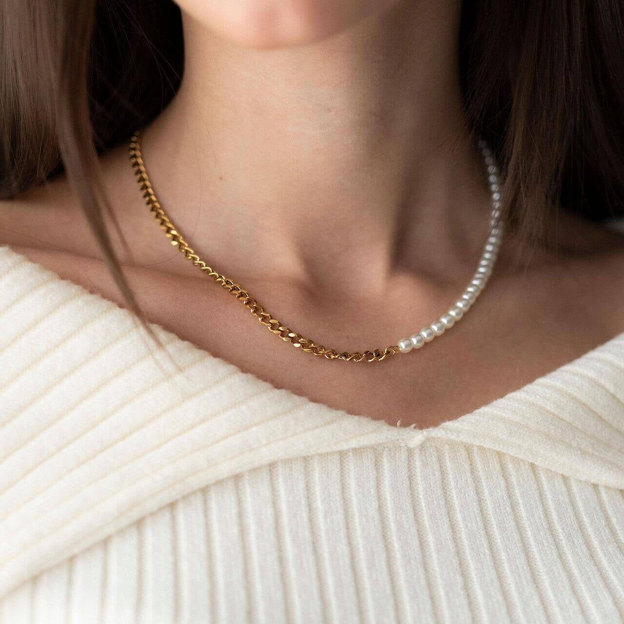 Hybrid pearl and chain necklace with 18K gold plating, worn elegantly, showcasing a stylish design.