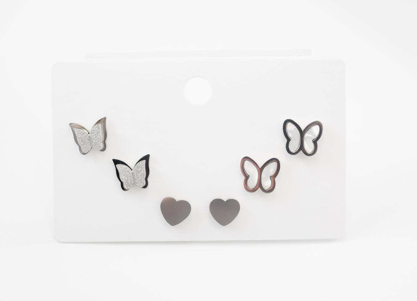 Modern butterfly and heart earrings set in gold and silver, designed for multiple piercings, made of medical stainless steel.