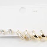 Комплект обеци с две златисти и сребристо камъни, идеални за три пиърсинг дупки, във водоустойчива медицинска стомана.