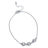 Сребриста гривна за глезен от медицинска стомана с три декоративни елемента.