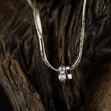 Сребристо двойно колие с пръстени