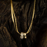 Златисто двойно колие с пръстени